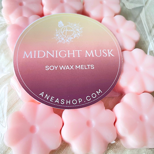 Pink soy wax melts with 'Midnight Musk' label and website 'aneashop.com' on a light background. PINK FLOWERS WAX MELTS