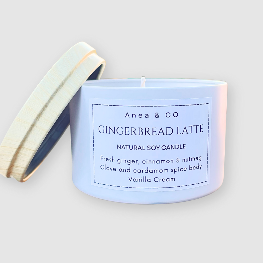 Candle with a label on a light gray background. GINGERBREAD LATTE SOY CANDLE