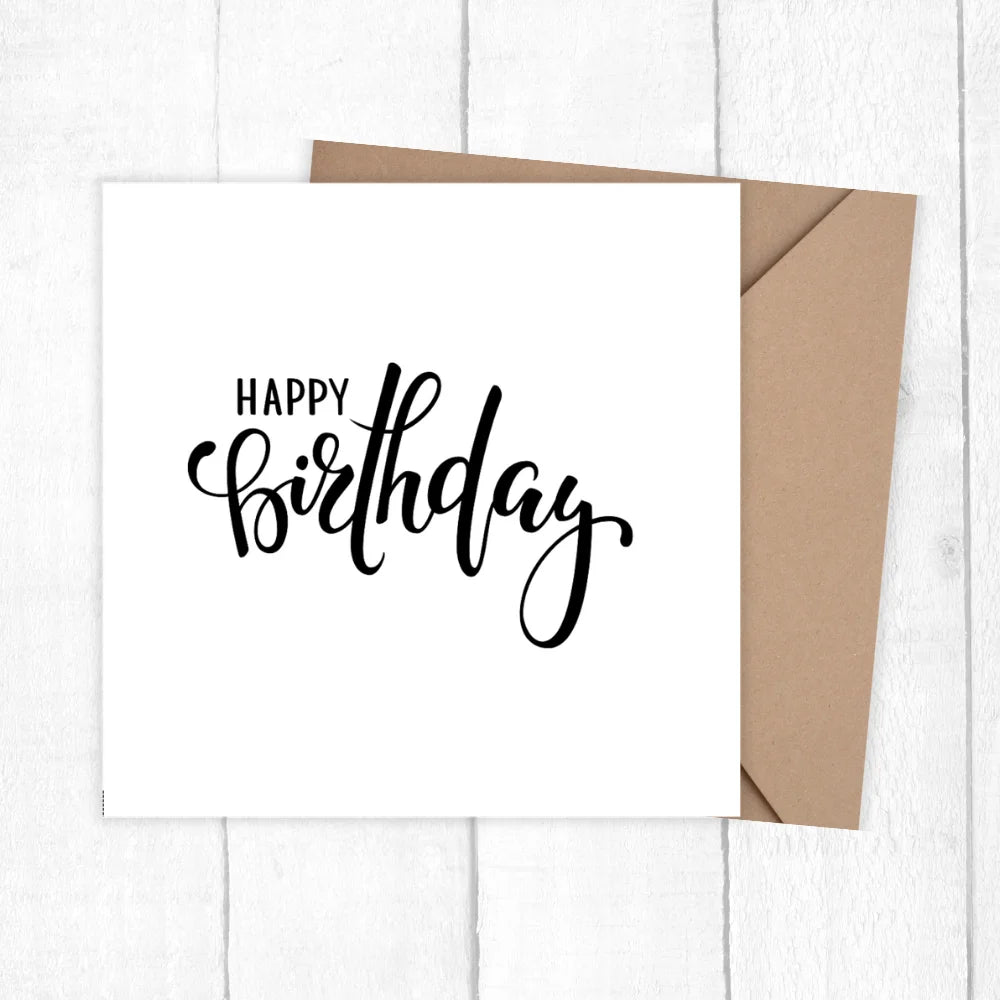 White card with 'Happy Birthday' text and brown envelope on a white background. HAPPY BIRTHDAY MINIMALIST CARD