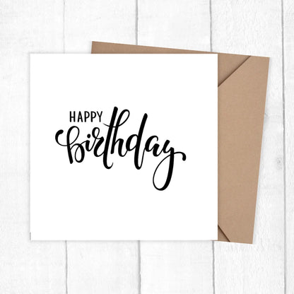 White card with 'Happy Birthday' text and brown envelope on a white background. HAPPY BIRTHDAY MINIMALIST CARD
