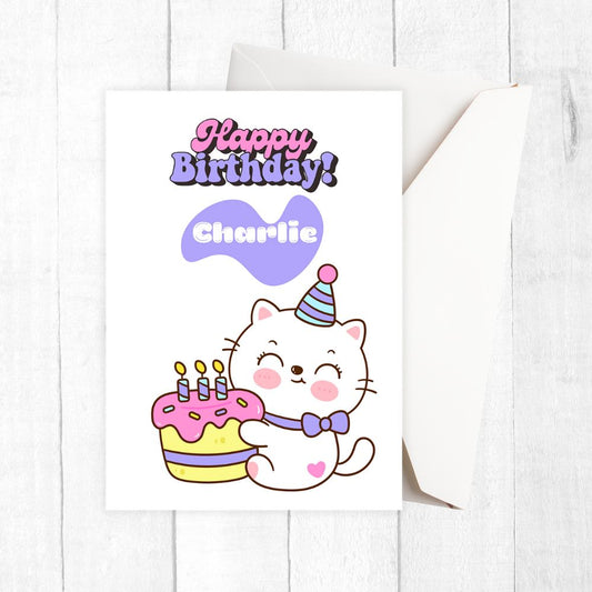 Birthday card with a cartoon cat holding a cake and the text 'Happy Birthday Charlie' on a white background. Kawaii Cake Cat Birthday Personalised Card,