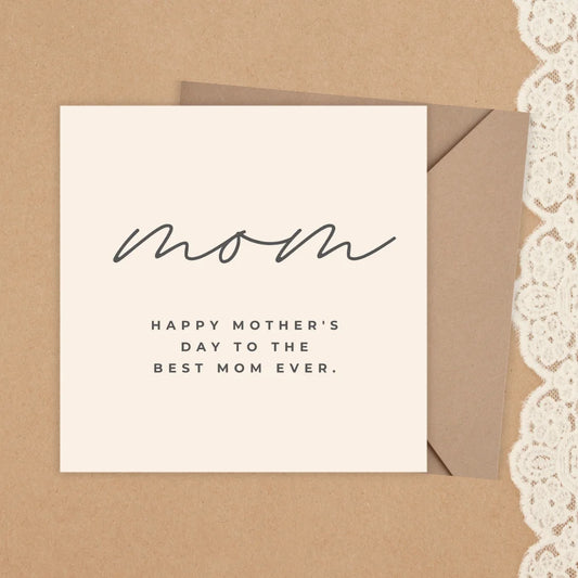 Greeting card with 'Happy Mother's Day to the best mom ever' text on a brown envelope with lace trim.MOTHER'S DAY CARD