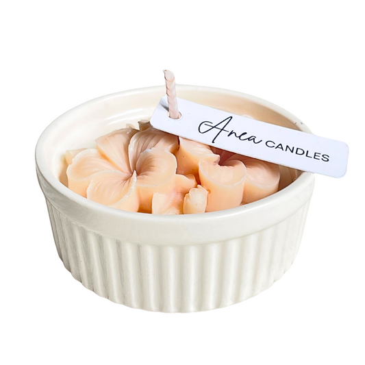 Candle in a white ramekin with 'Anew Candles' label on a white background. natural flower SOY CANDLE