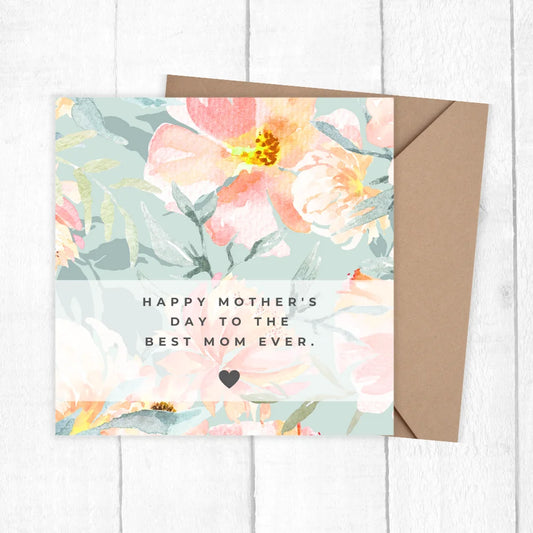 Floral Mother's Day card with a brown envelope on a white wooden surface. PASTEL FLOWERS MOTHER'S DAY CARD 