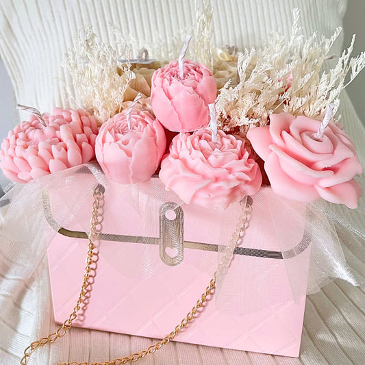 Pink flower-shaped candles in a decorative box with gold chain. PINK & CREAM CANDLE FLOWER BOUQUET BAG