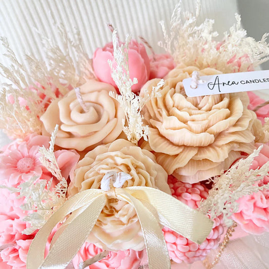 Decorative candles shaped like flowers with pink and beige colors, featuring a brand tag. PINK & CREAM CANDLE FLOWER BOUQUET BAG