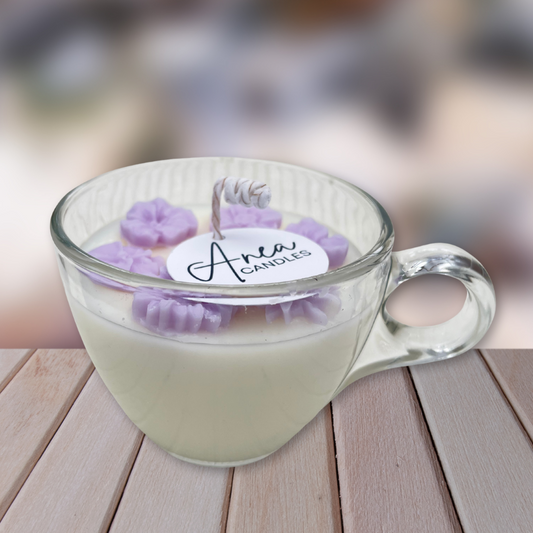Glass mug with purple candles labeled 'Anea Candles' on a wooden surface. Natural Coconut - Rapeseed Wax
Sandalwood Fragrance